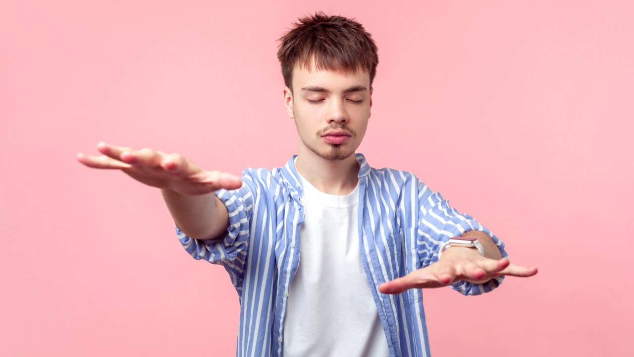 Man with eyes closed feeling around