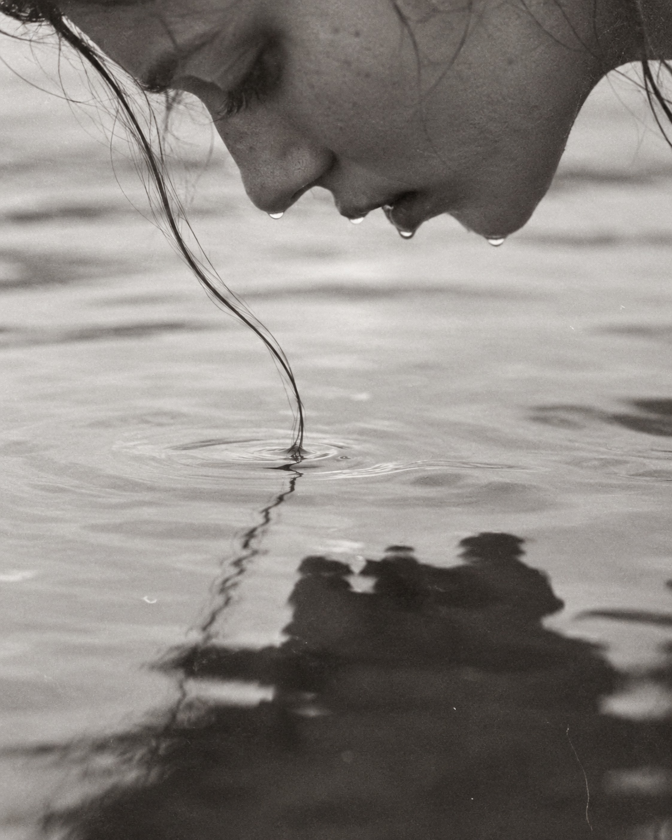 A face turned down to the water