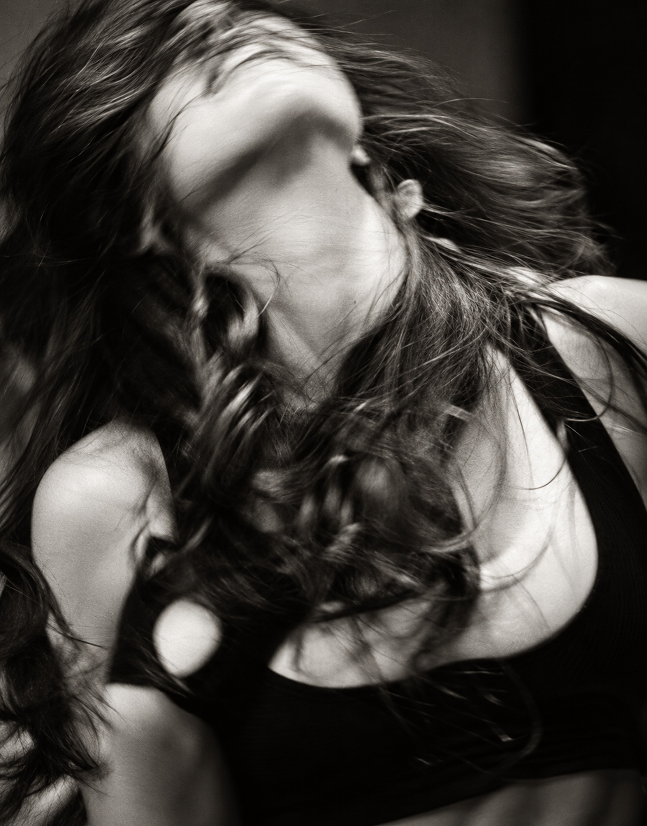 Hair flying as a woman turns