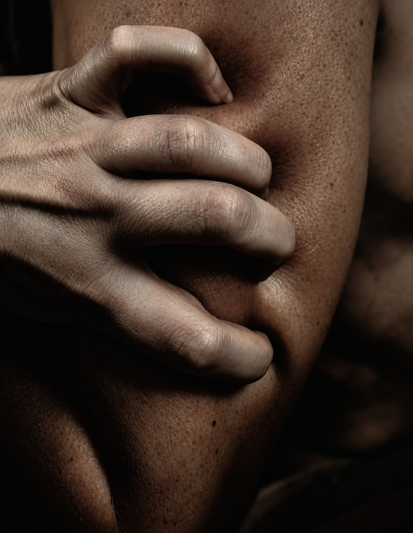 A hand resting on skin