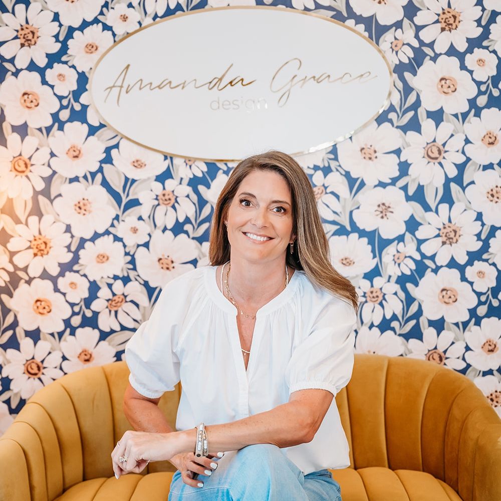 Mandy Corcoran surface pattern design sitting on a couch in her office