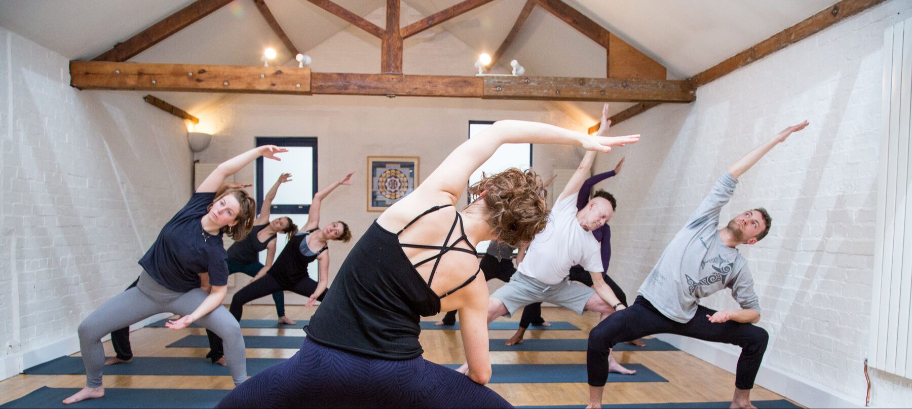 Yoga class in a side stretch pose
