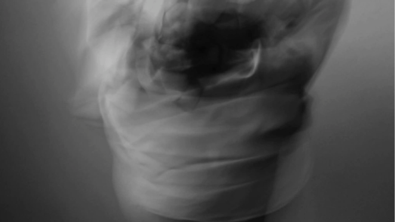 Person moving through a somatic movement practice at home as part of a daily nervous system care routine