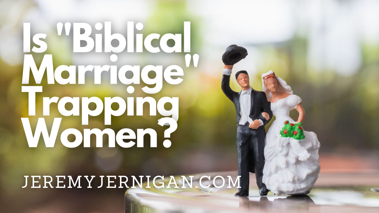 Miniature bride and groom figurines on a wedding cake, the groom tipping his hat while the bride stands slightly apart, under the title "Is 'Biblical Marriage' Trapping Women?"