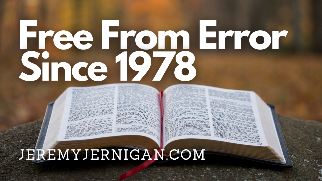Open Bible on a stone in autumn light with the title "Free From Error Since 1978," a post on the history of biblical inerrancy