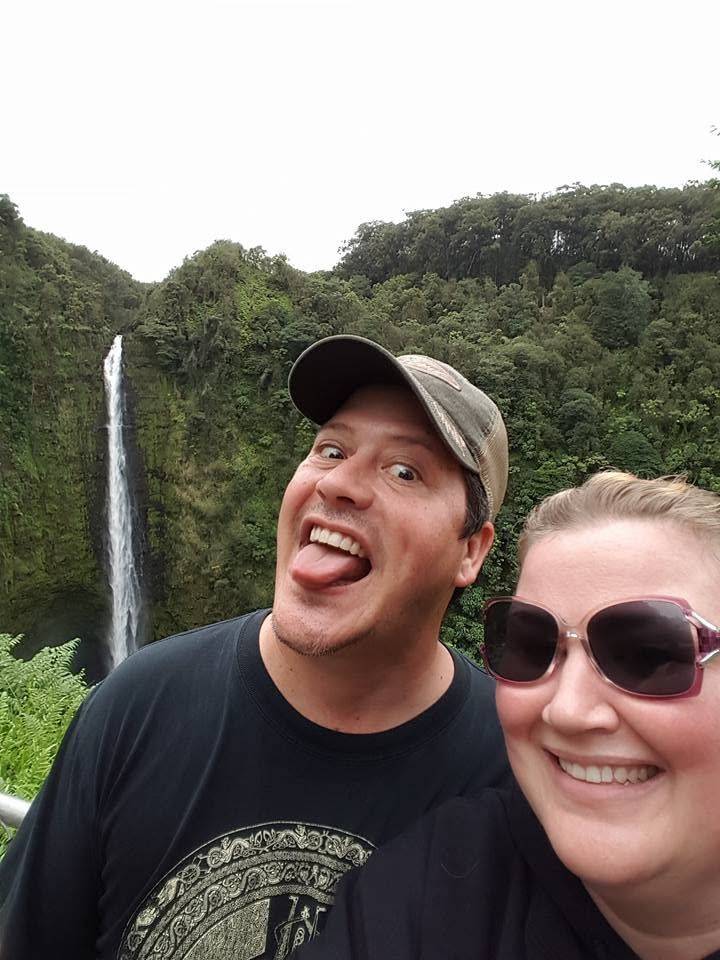 Brent and Amethyst in front of a waterfall. Brent is sticking out his tongue and being generally goofy.