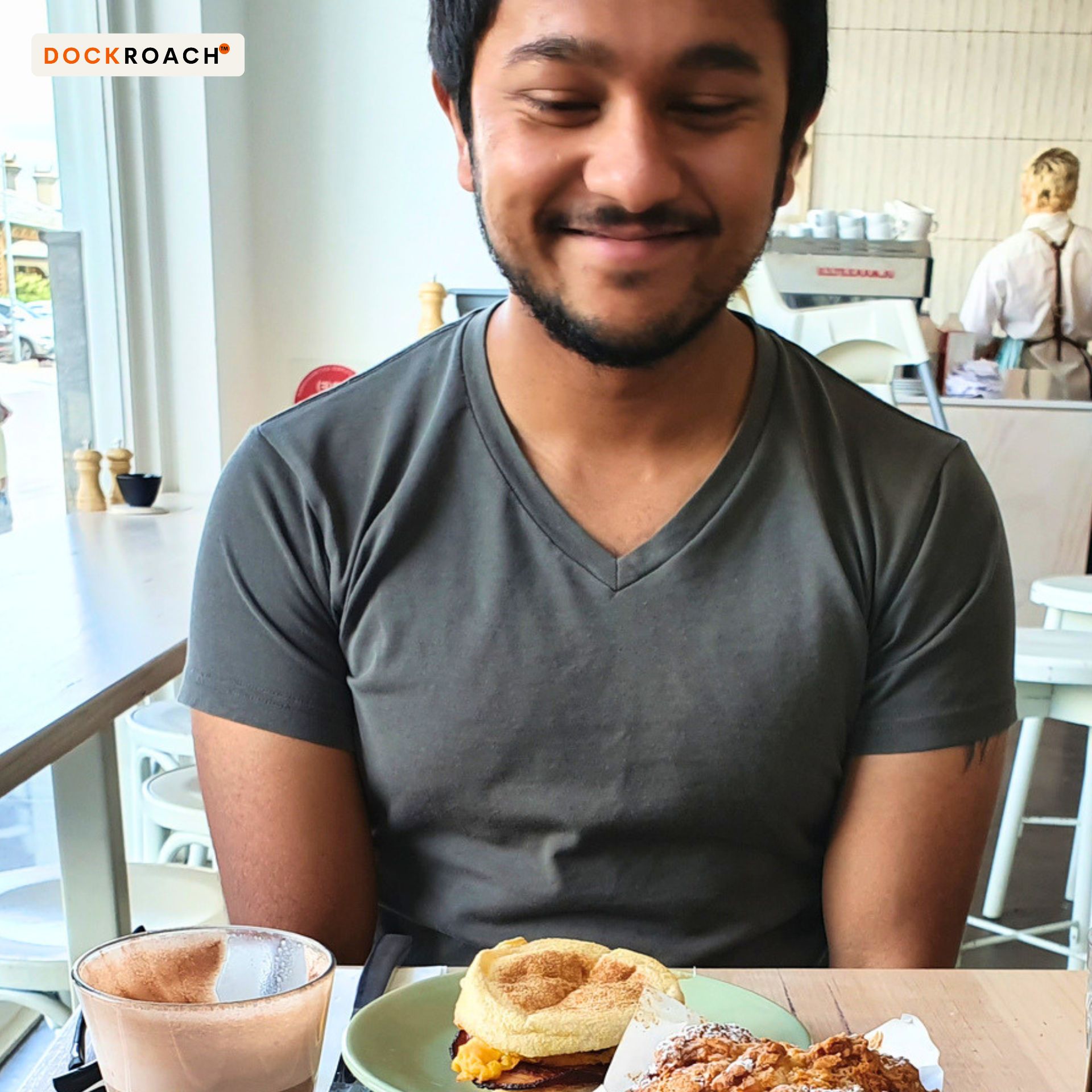 Dr Aarons sitting in a café on his 30th birthday during the early stages of rebuilding his medical career in Australia.