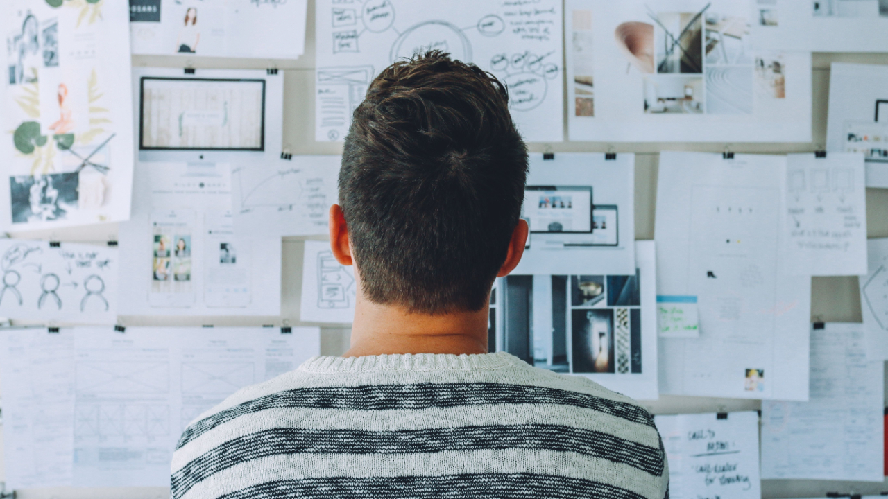 A person looking at a complex board of documents