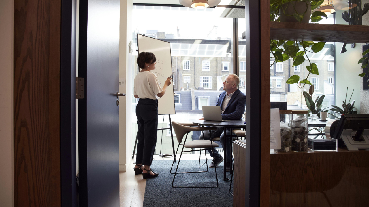 A women presenting strategy to coworker