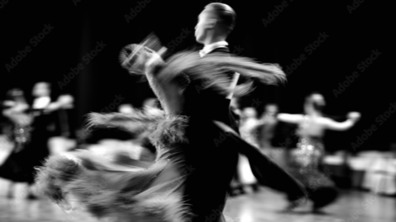 A blurry image of two people dancing
