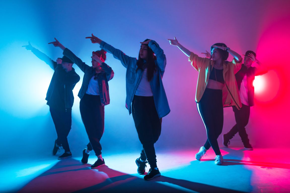 Group dancing in artificial lighting