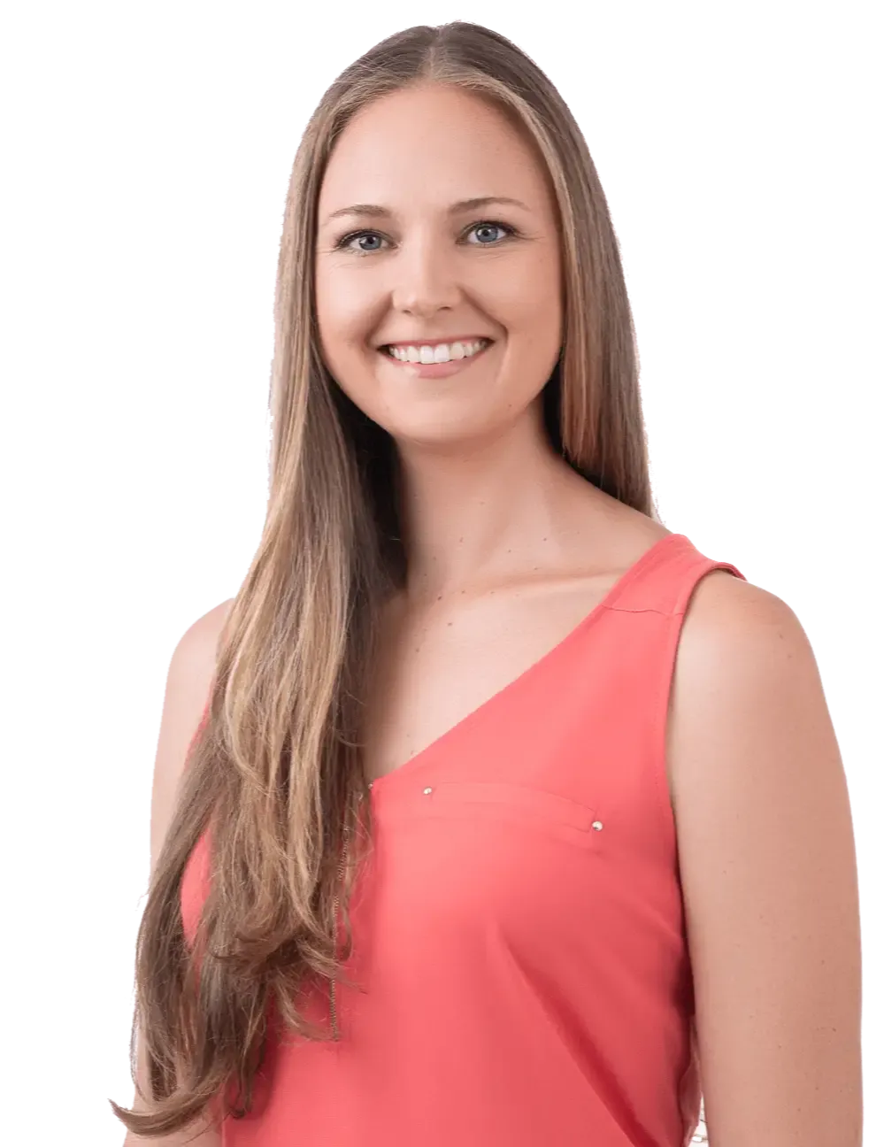 Theresa White, wearing a sleeveless coral top, smiles while looking at the camera, exuding the confidence as a career clarity coach.