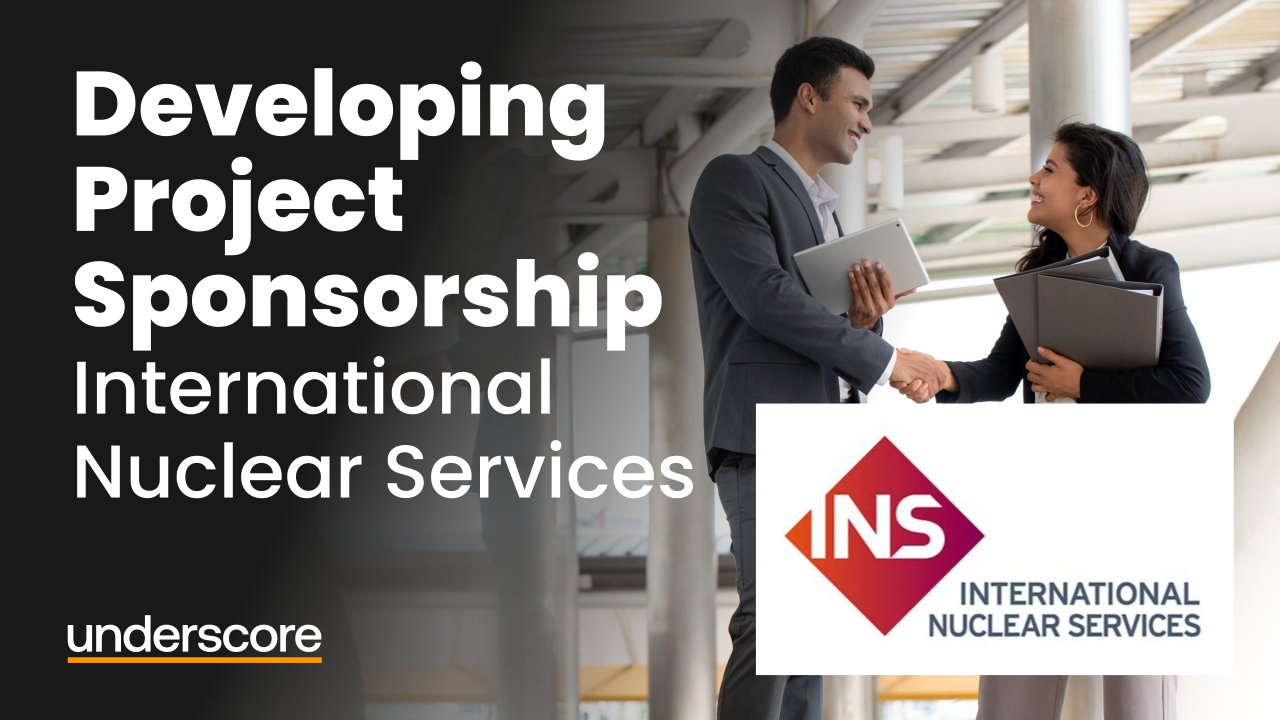 Two professionals shake hands while holding laptops and documents. The text reads “Developing Project Sponsorship – International Nuclear Services,” with the INS logo and the Underscore logo on a dark background.
