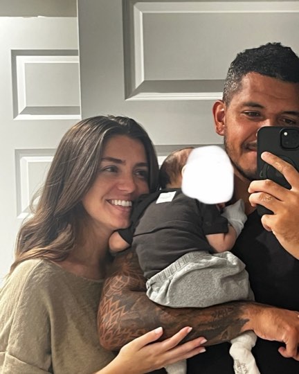 Matt and Kelley at home with their baby
