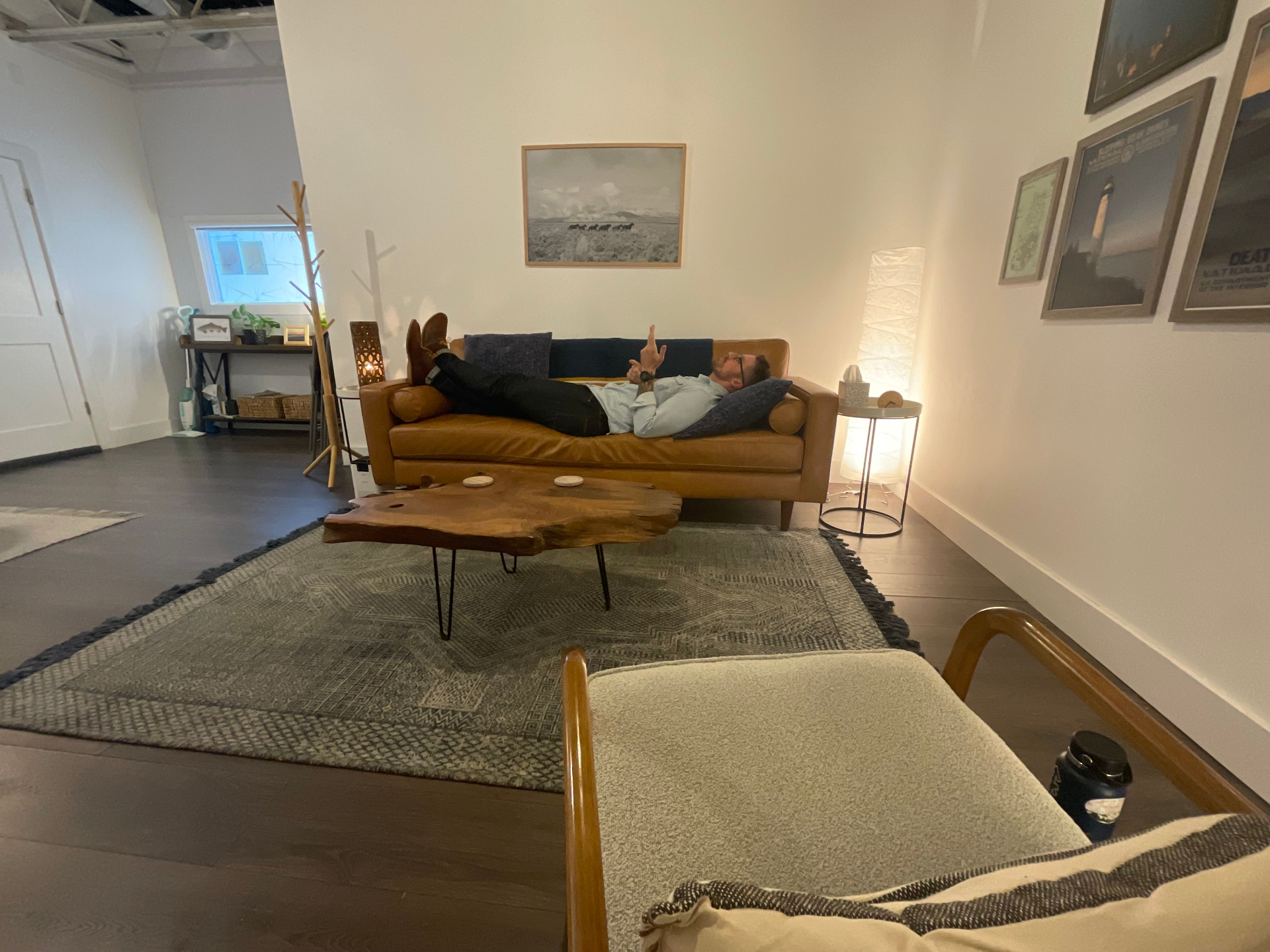 A man relaxing at home, representing the comfort and openness of individual therapy for men at Metro-Detroit Men's Therapy