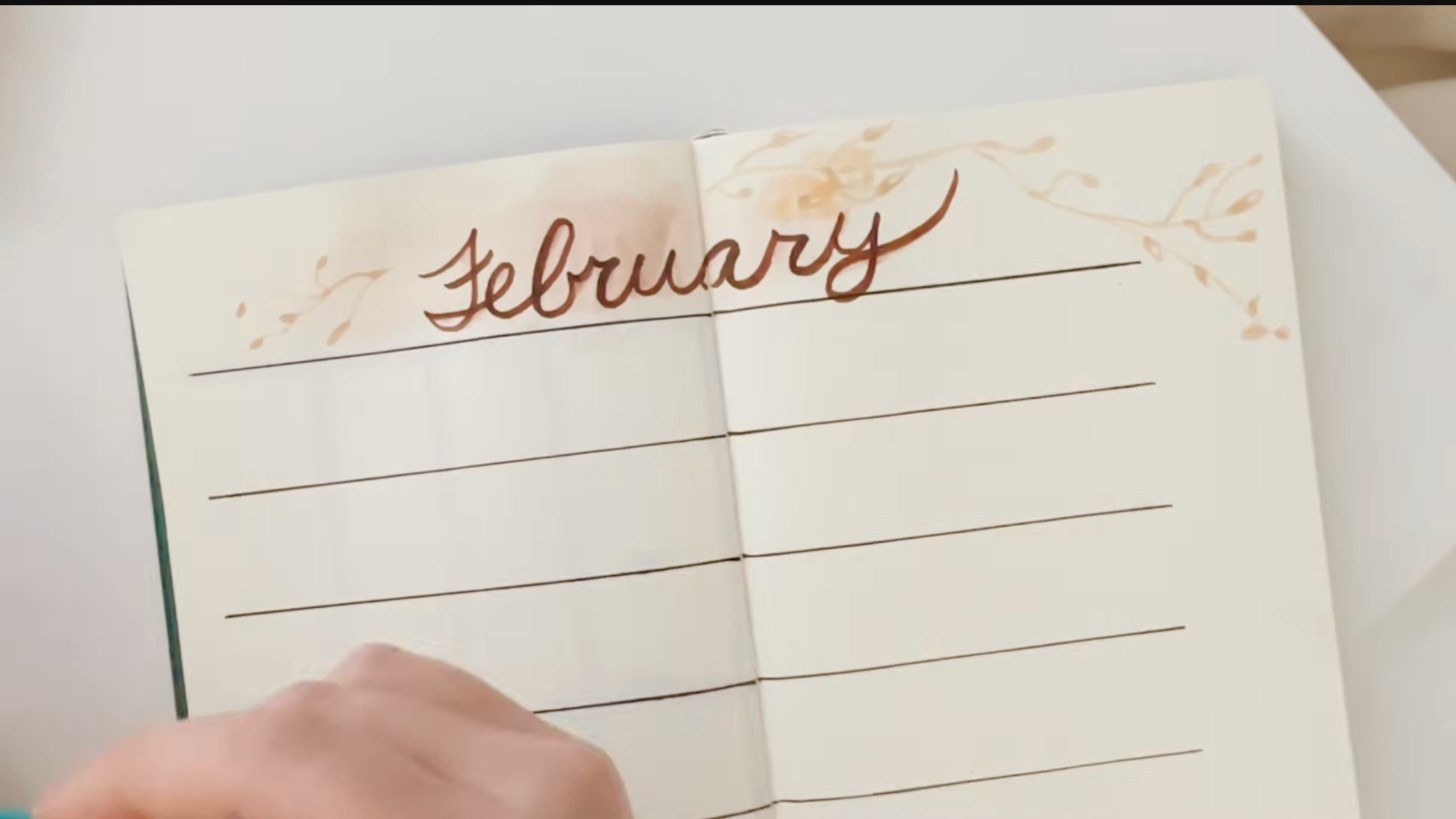 A minimalist February calendar spread with watercolor lettering