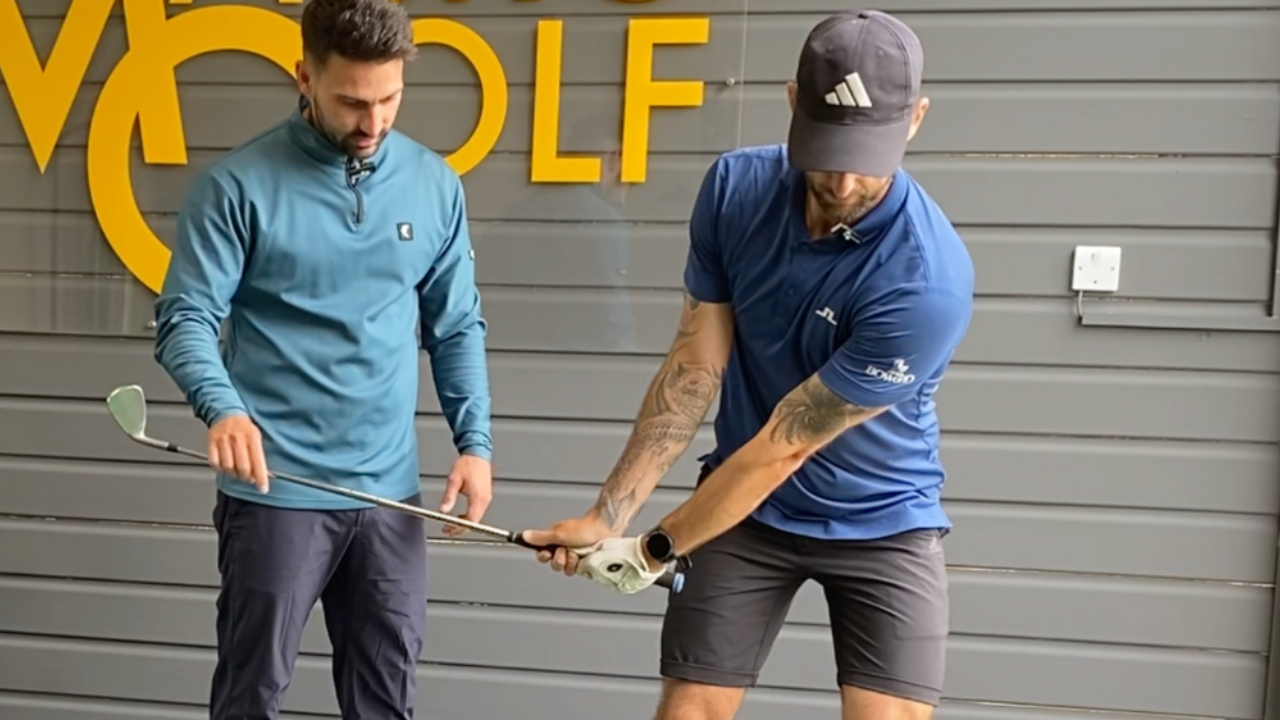 Golfer working with a coach on their individual golf swing