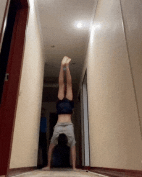 Member doing handstand walk