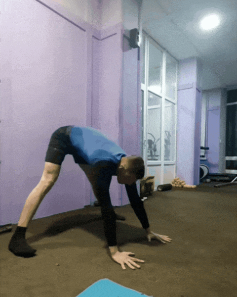 Member doing press handstand