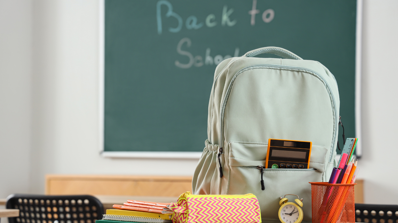back pack and school supplies on a desk