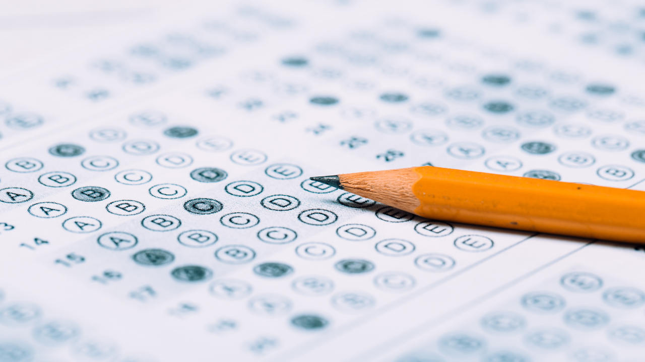multiple choice answer sheet with pencil