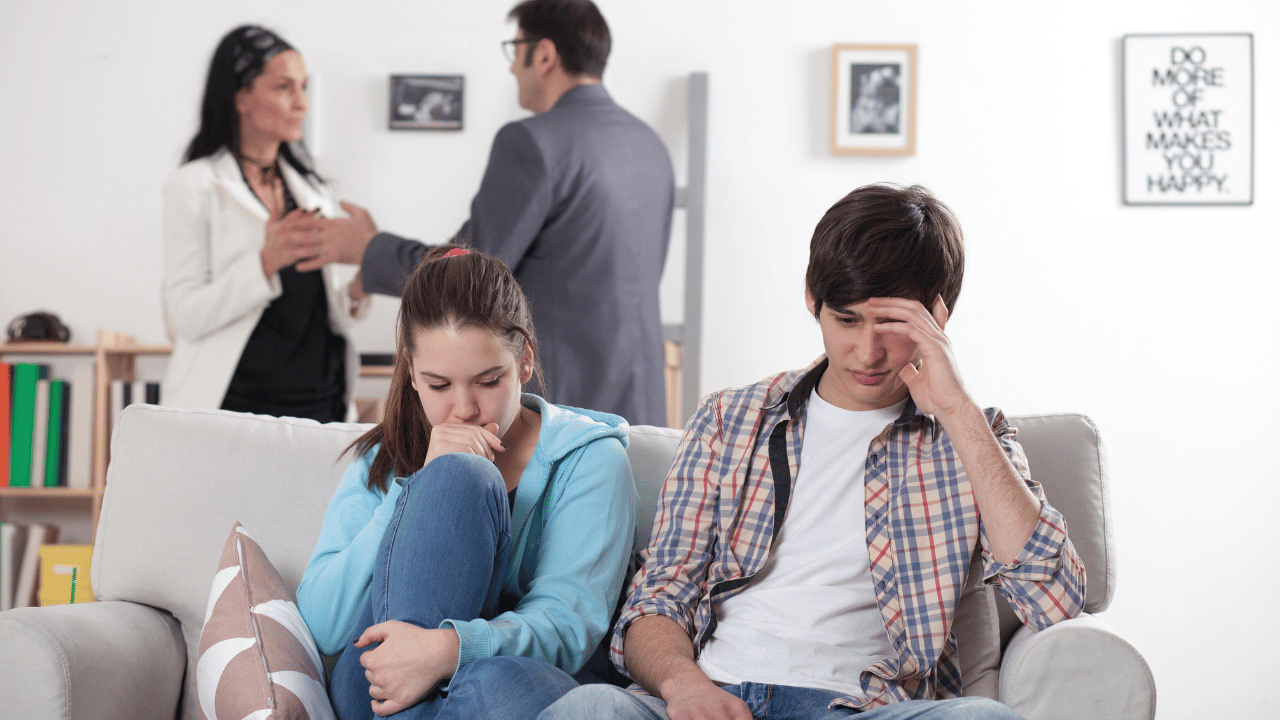 Kids upset; parents arguing in background
