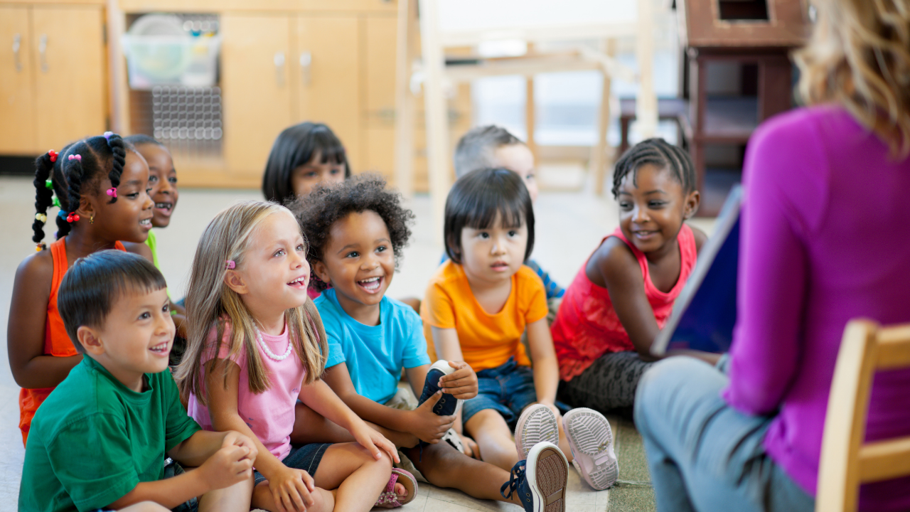 kids sitting listening to a teacher