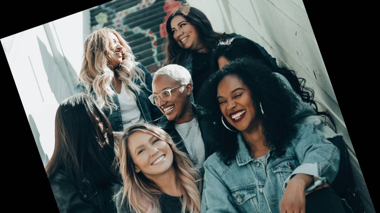 Group of happy women standing next to each other