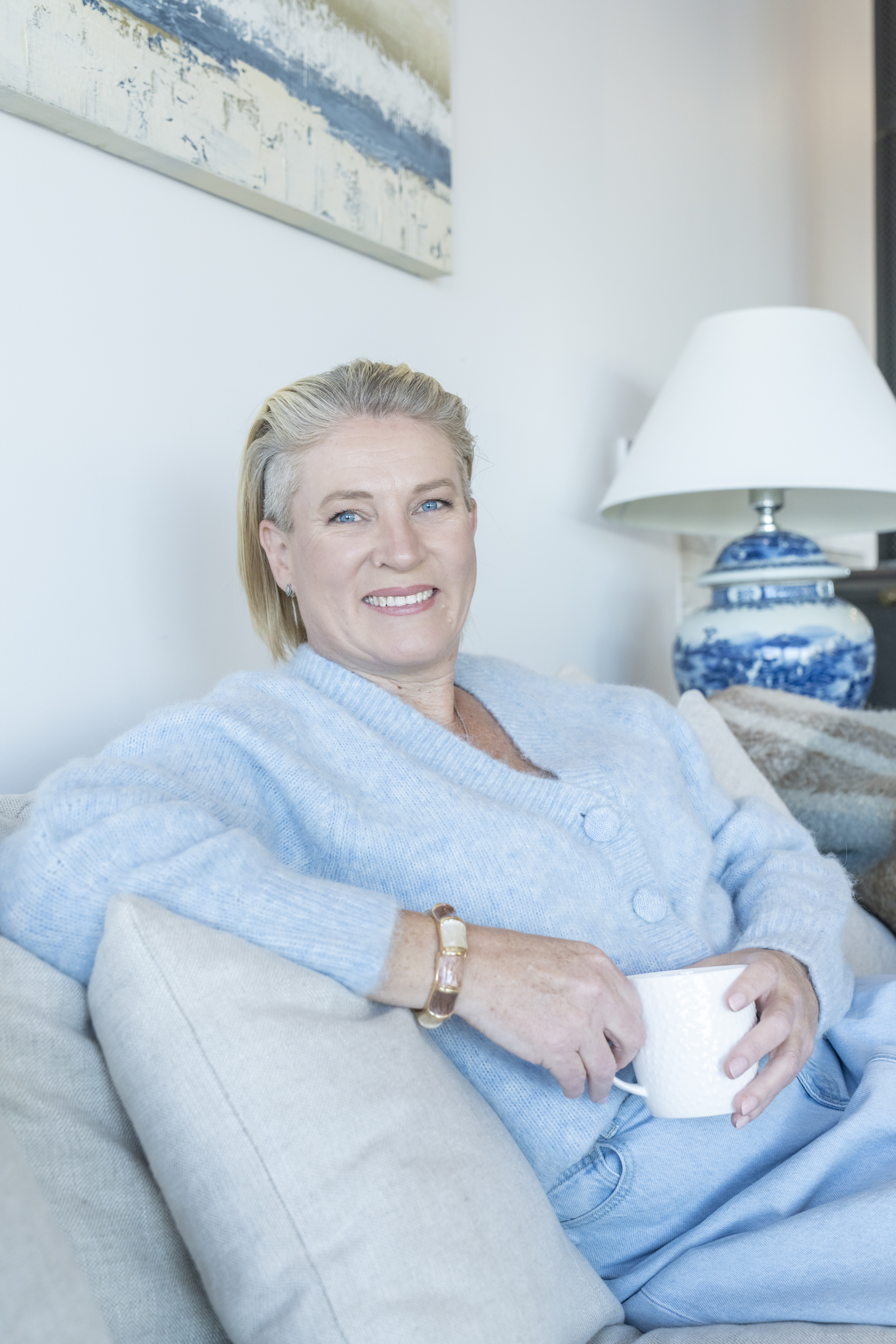 Erin Davis sitting in a soft blue jumper