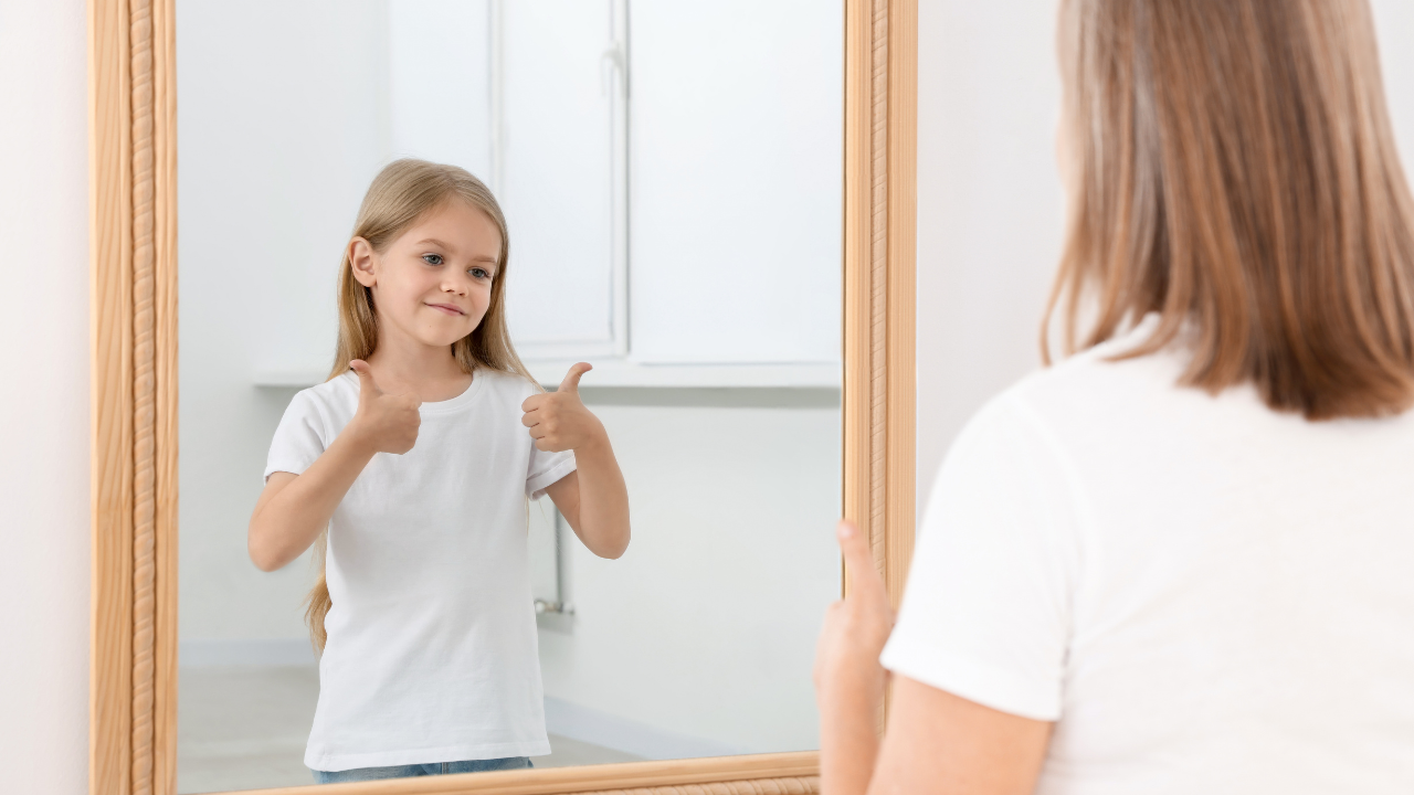 Women looking into mirror to inner child for guidance and confidence