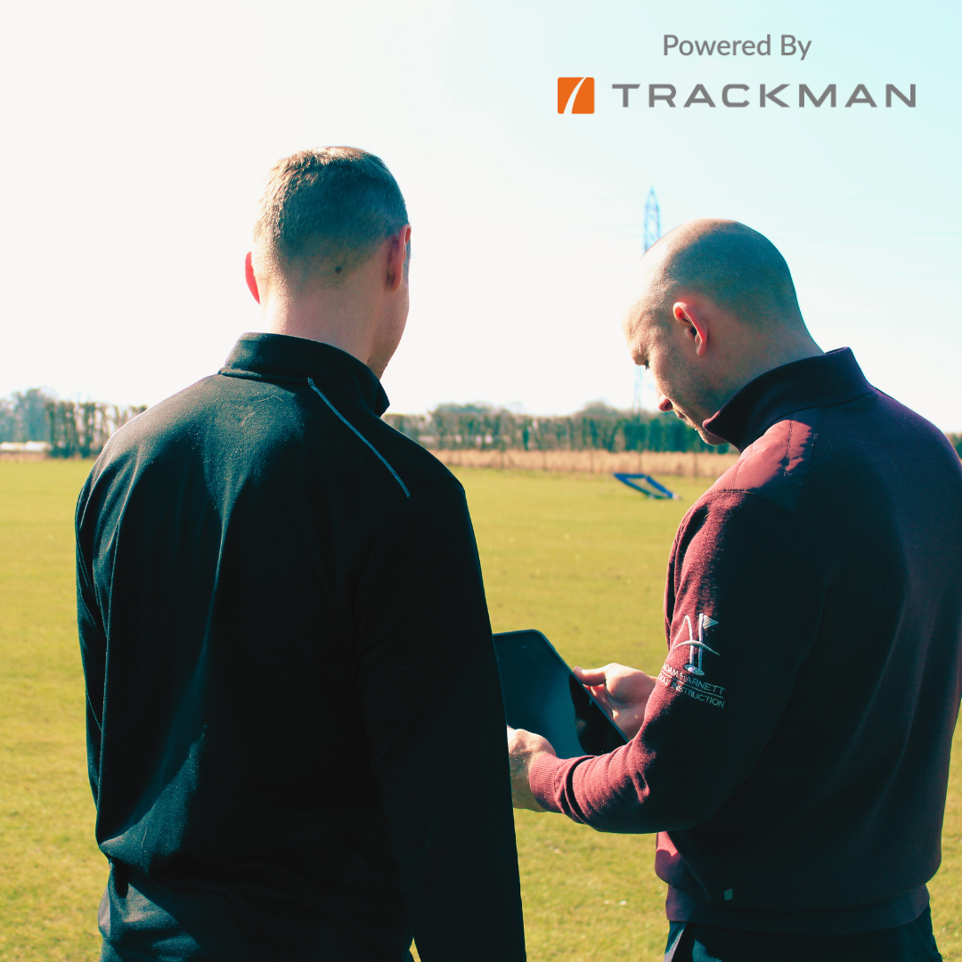 A picture of a golf coach teaching a golfer the backswing