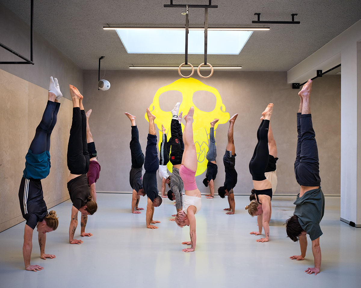 Group handstand practice at Crazy Monkey in Amsterdam