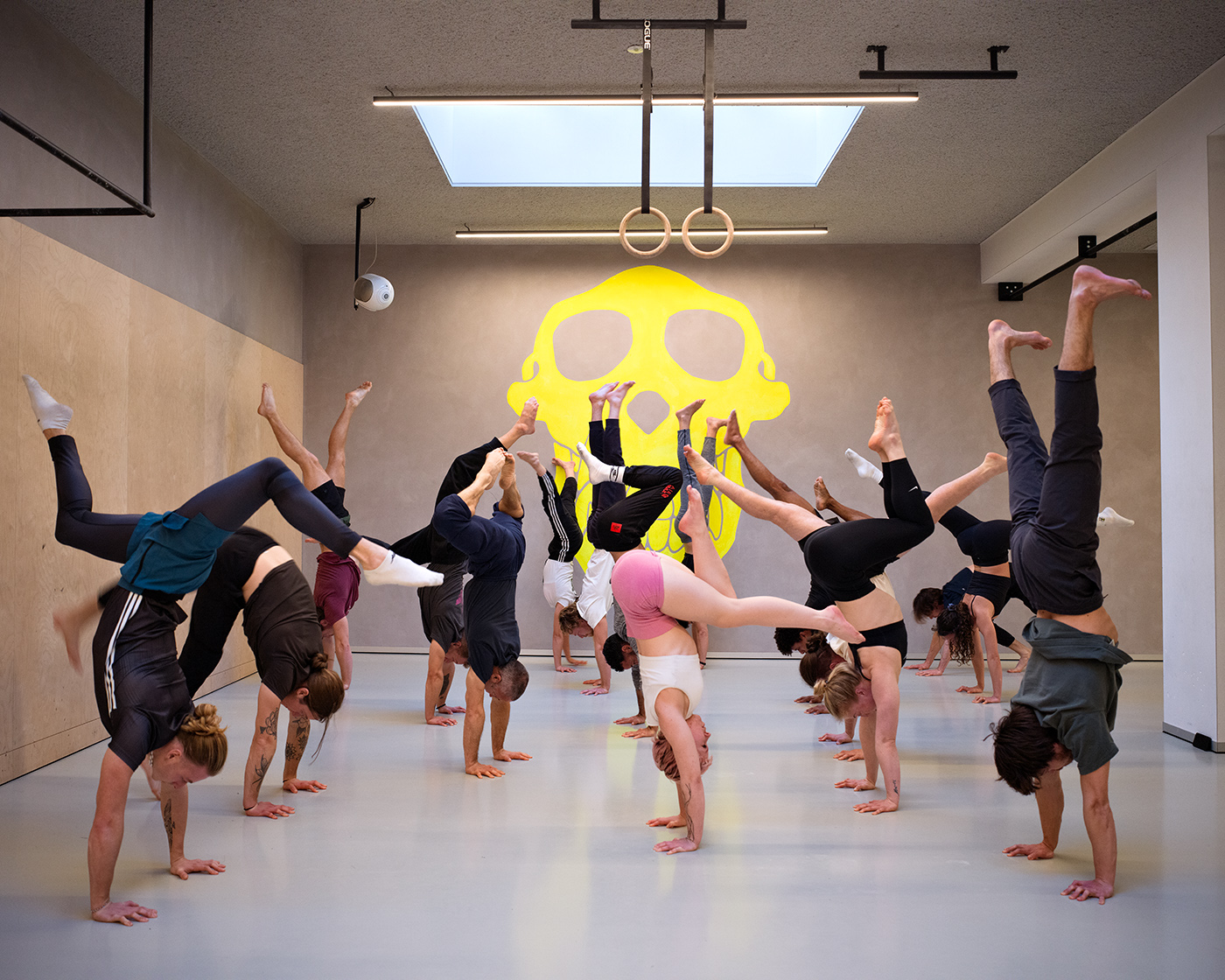 Group exploring different handstand shapes at Crazy Monkey Amsterdam