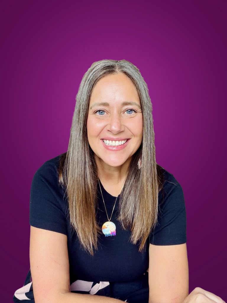 Kara Bunde-Dunn smiling against a plum background