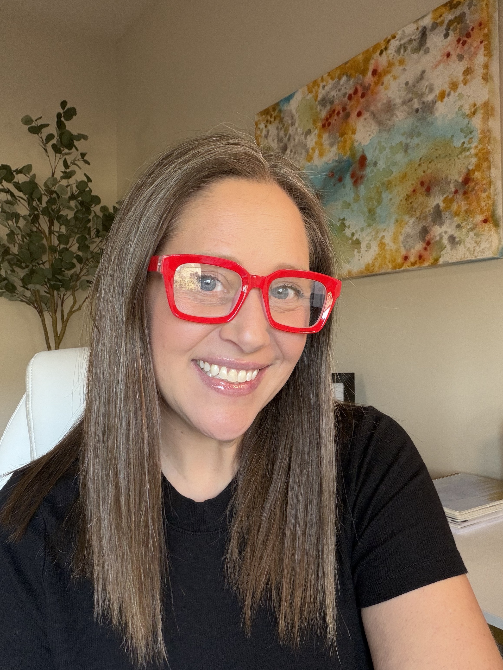 Kara Bunde-Dunn in red glasses, smiling