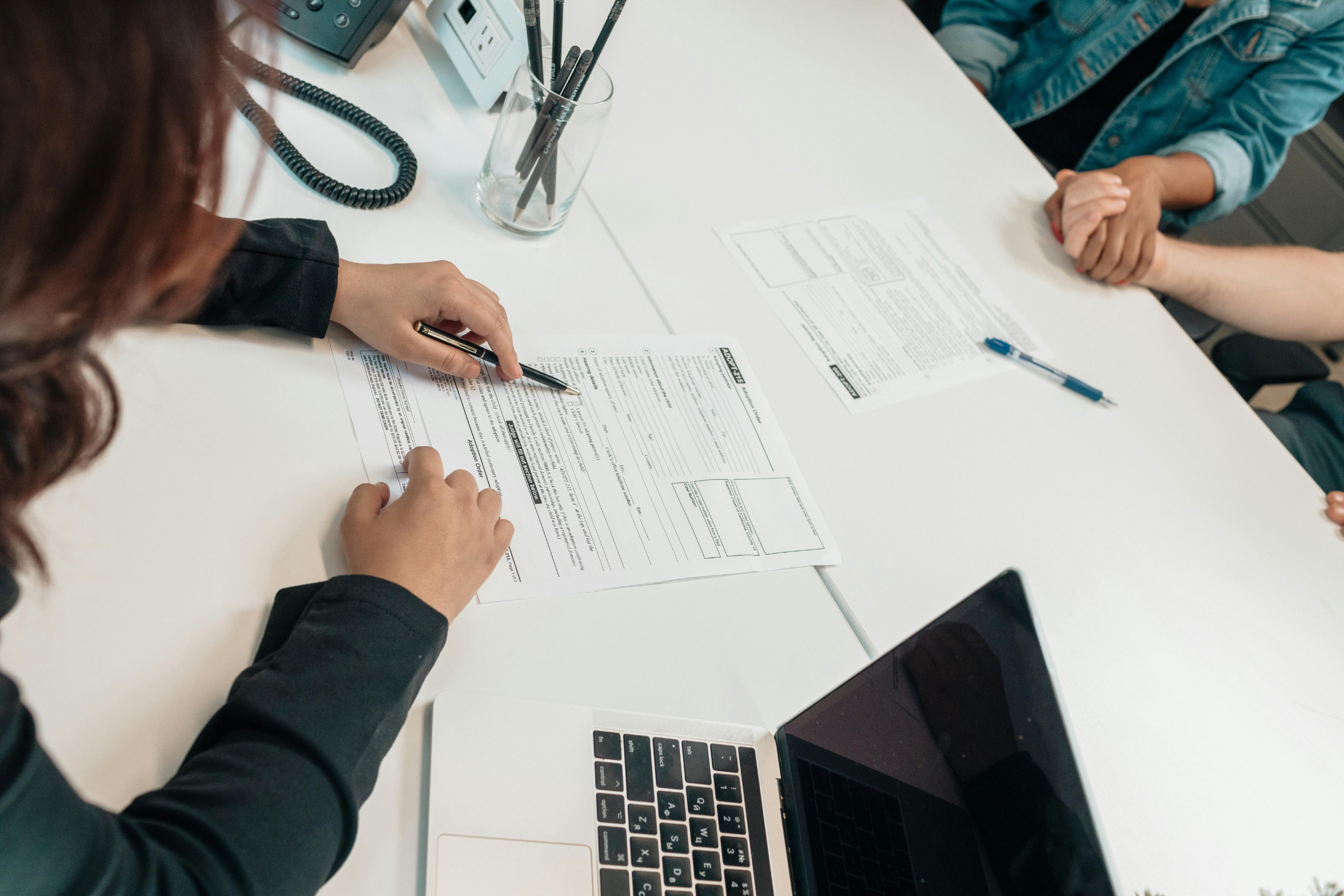 Image of a lawyer and a client discussing about the document.