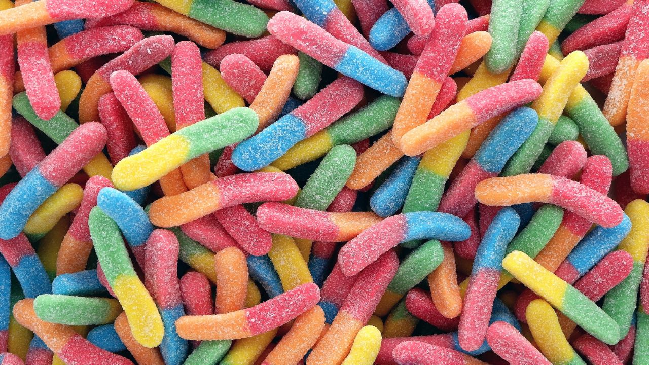 Assorted candies showcasing the vibrant colors enriched with various food dyes.