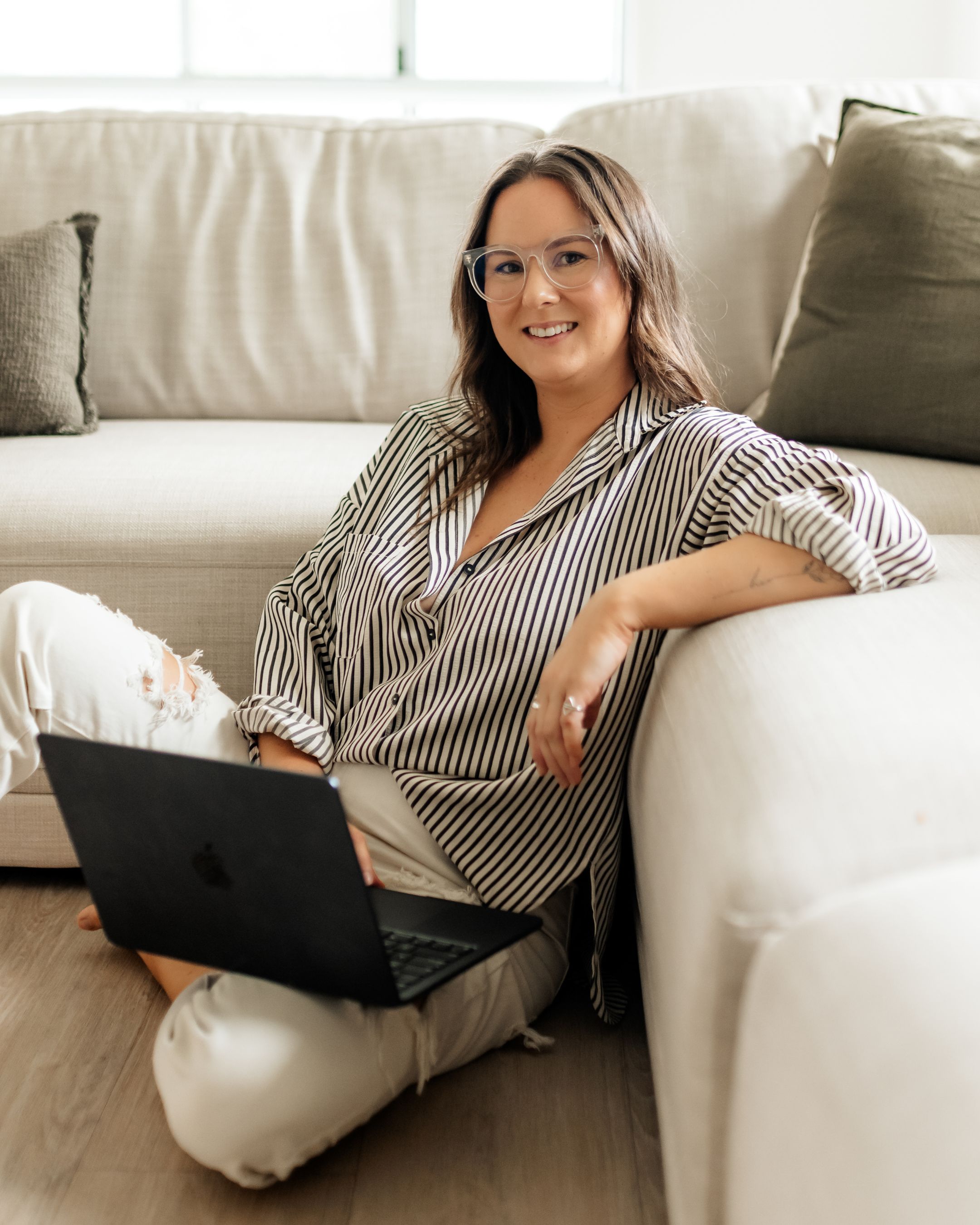 Salon owner working at her laptop reviewing course material
