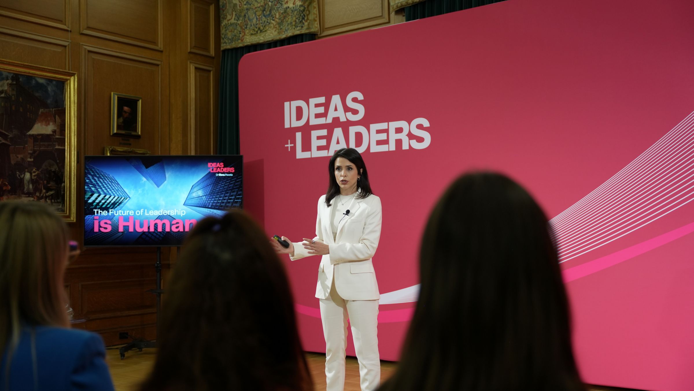 Dr Elena Pawęta speaking on stage
