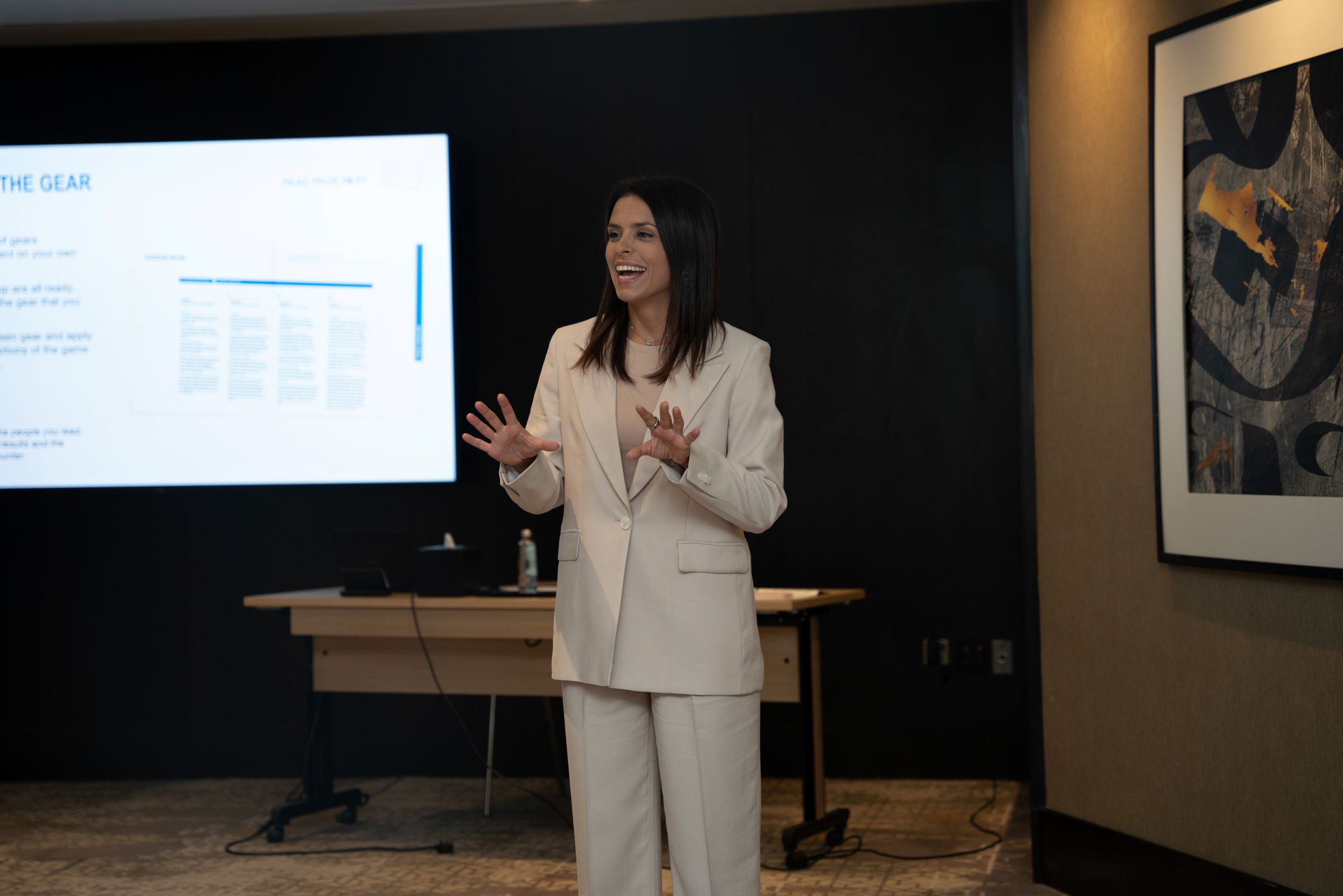 Elena working with leaders in a training room