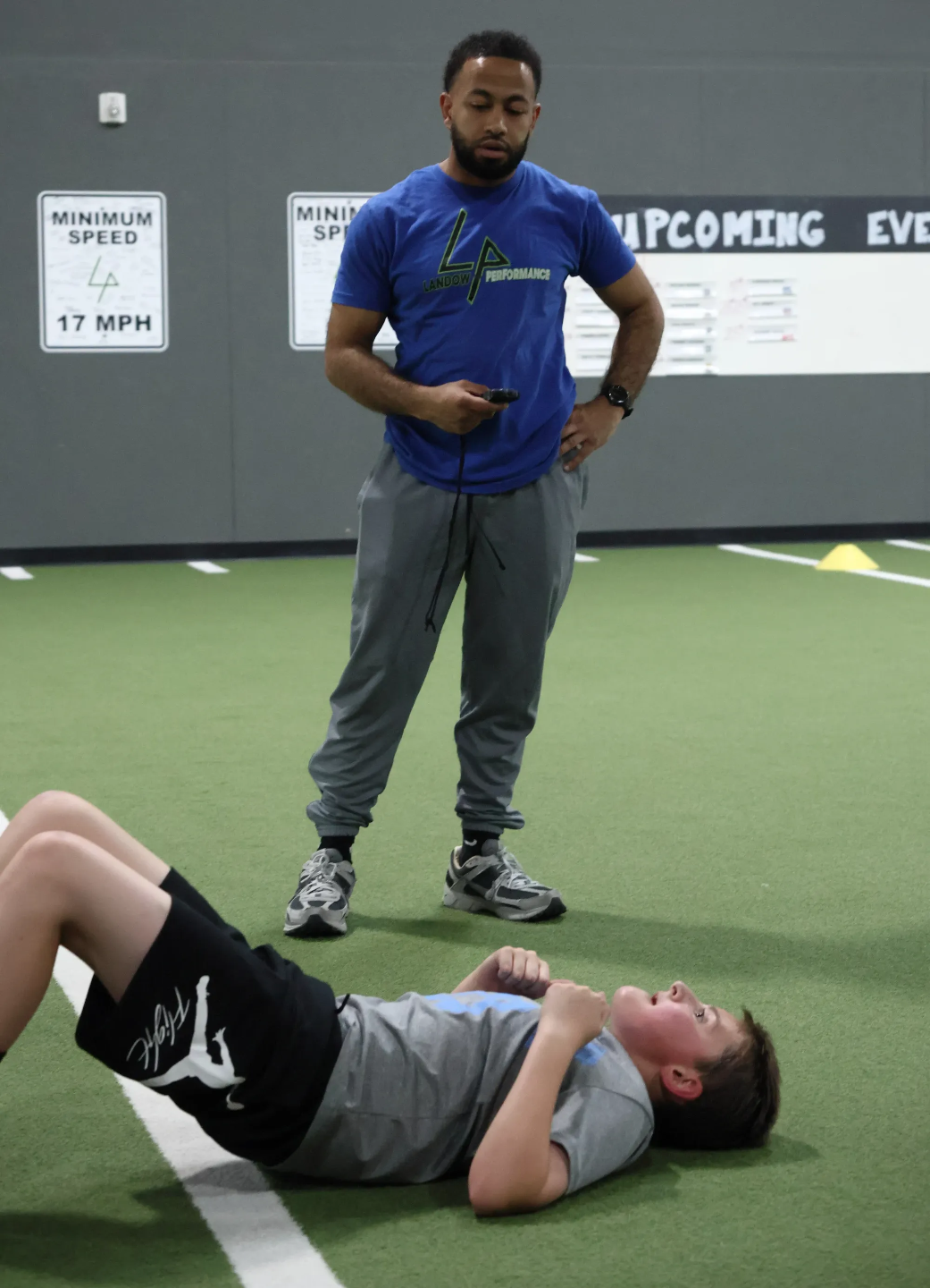Coach Nas Aljamal coaches a youth athlete at Landow Performance in Centennial, CO