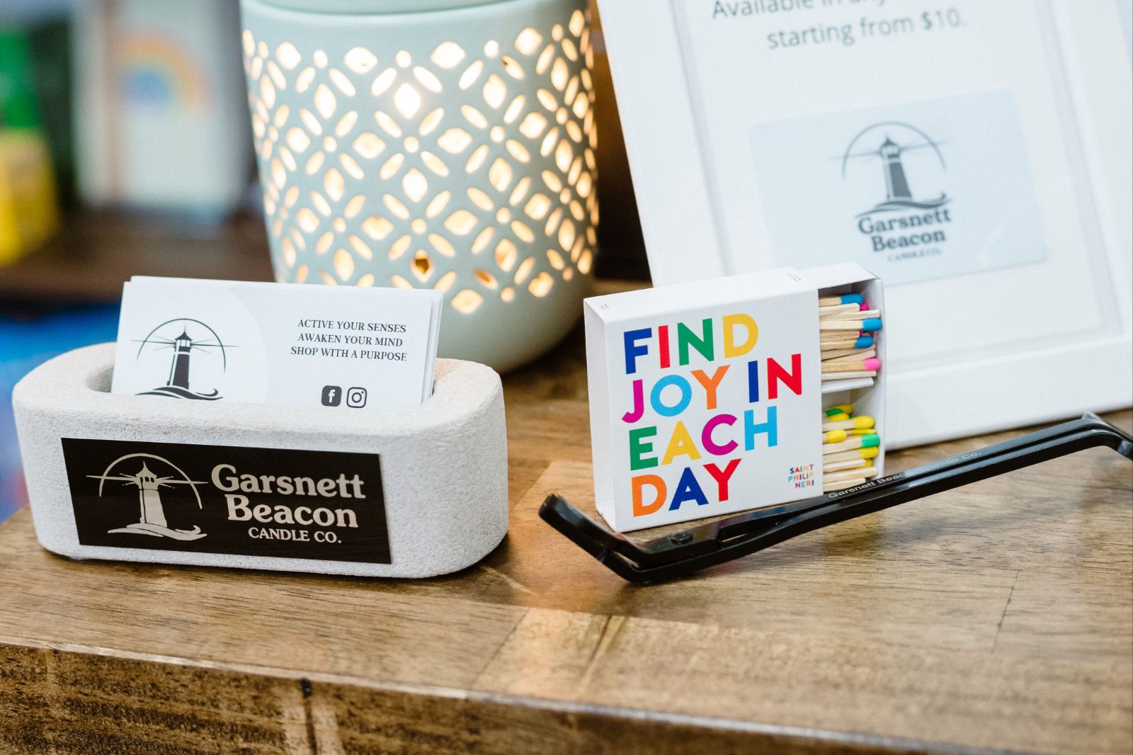 A Garsnett Beacon Candle Co. retail counter display