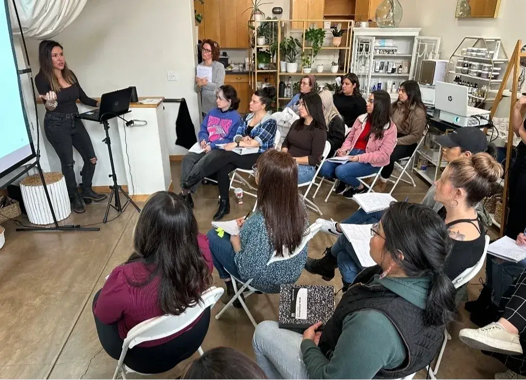 Jonelle Duvall teaching a full room at a Beauty Business Bootcamp