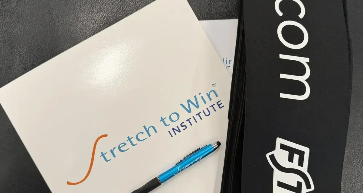 The Stretch to Win workbook, branded pen and FST strap provided at the course