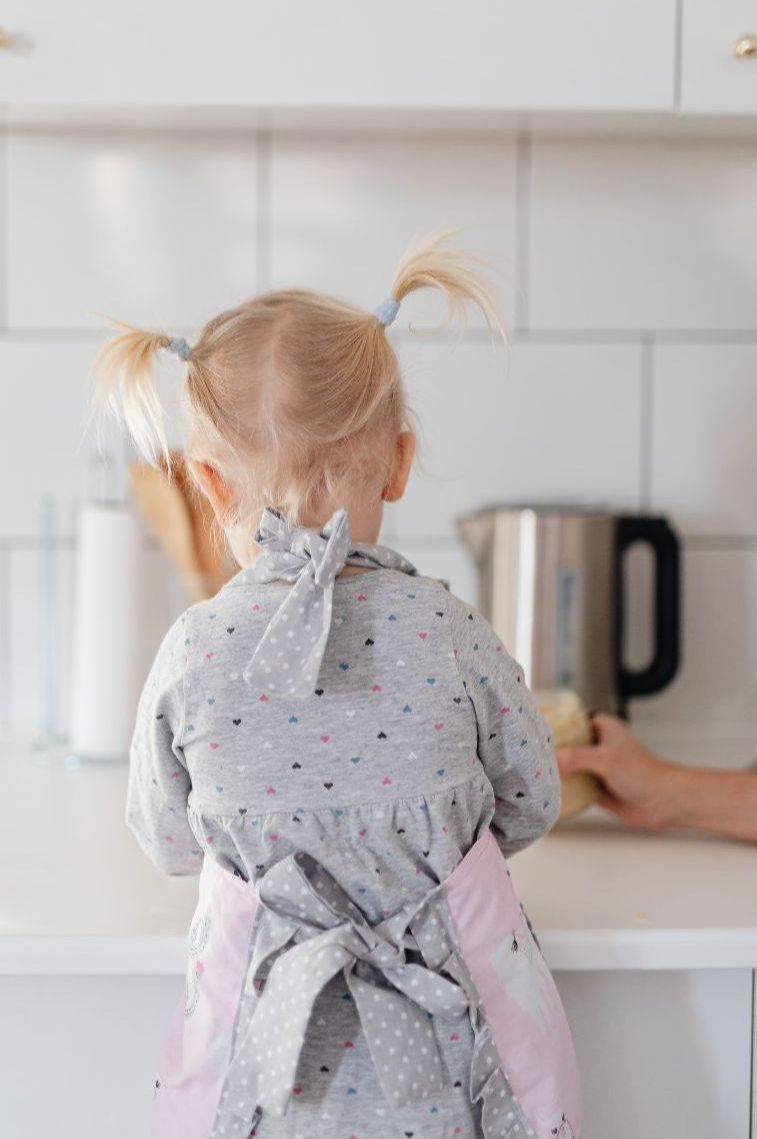 Child preparing food in the kitchen