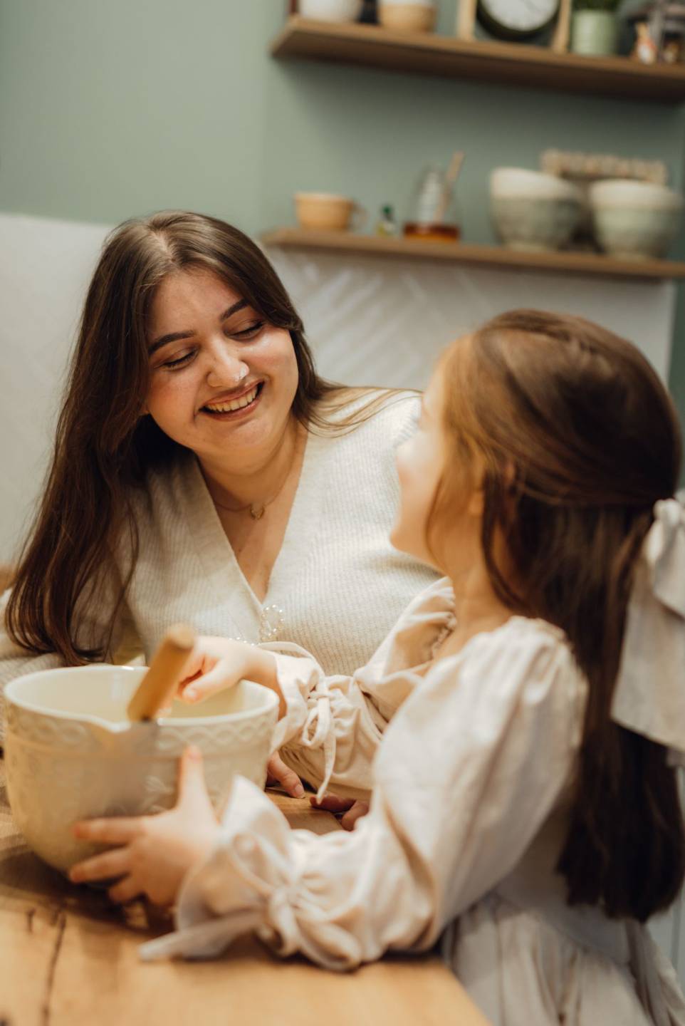 Mother and daughter cooking together and enjoying a positive food experience