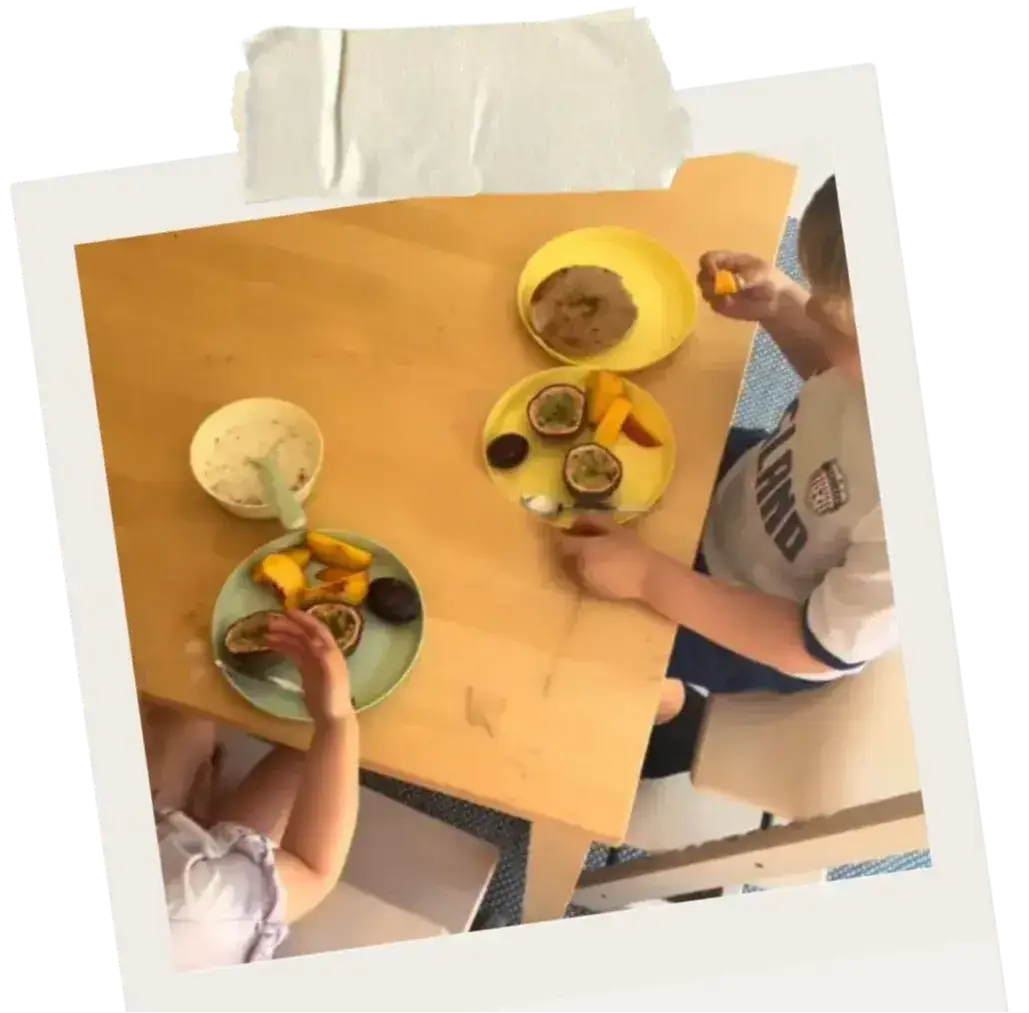 Children exploring different foods together during mealtime