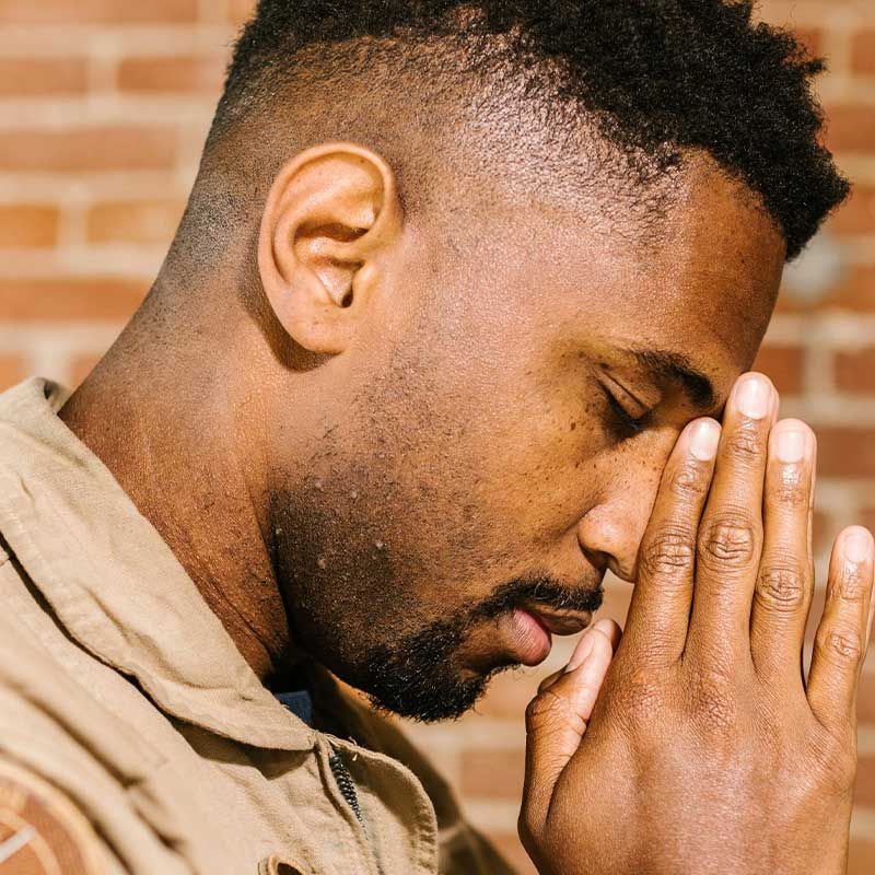 picture of man praying with folded hands
