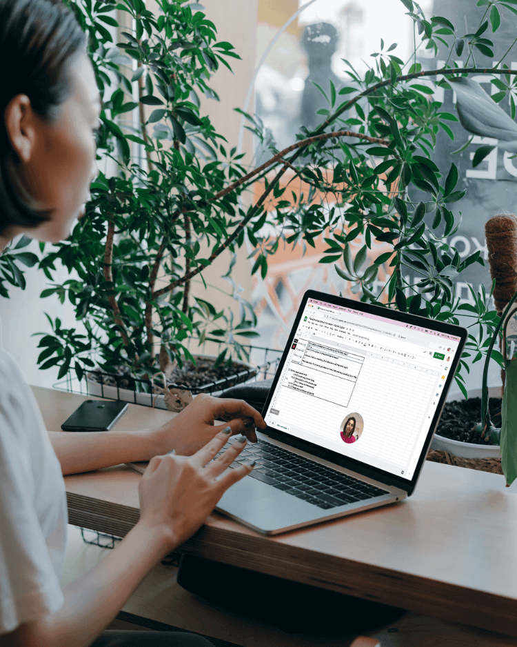 A woman completes the Conversion Magic digital marketing course from a cafe.
