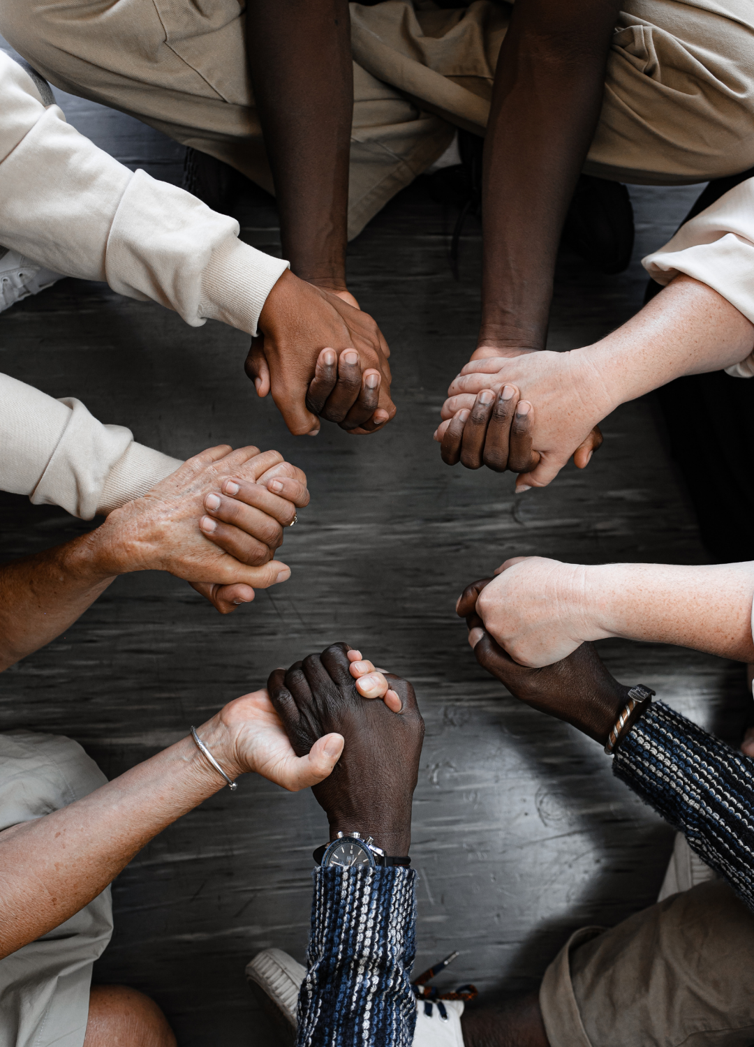 Parents holding hands in a circle of support